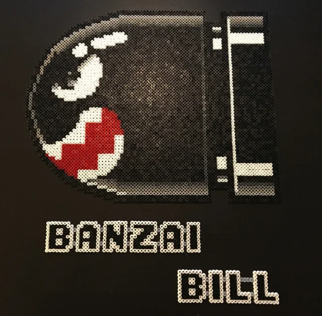 Pixel Art - Banzai Bill på tavla i trä
